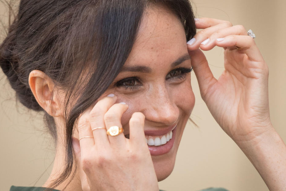Die Baby-Bombe ist geplatzt: Jetzt hat Meghan noch mehr Grund zu strahlen.