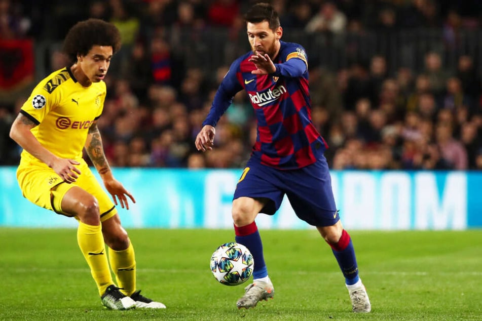 Lionel Messi (r.) bestritt für den FC Barcelona sein 700. Pflichtspiel, bereitete das 1:0 und 3:0 der Katalanen vor und erzielte das 2:0 selbst. Hier behauptet er sich gegen Dortmunds Axel Witsel.