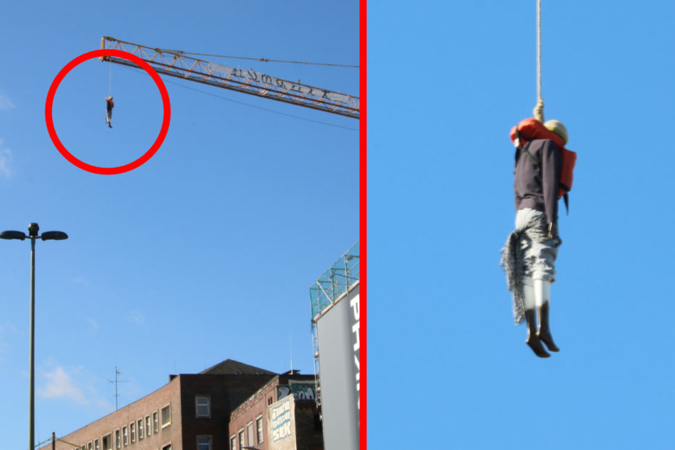 A doll, attached to the crane with a bilge rope, shocked the Berlin Sunday morning at a Neukölln construction crane.