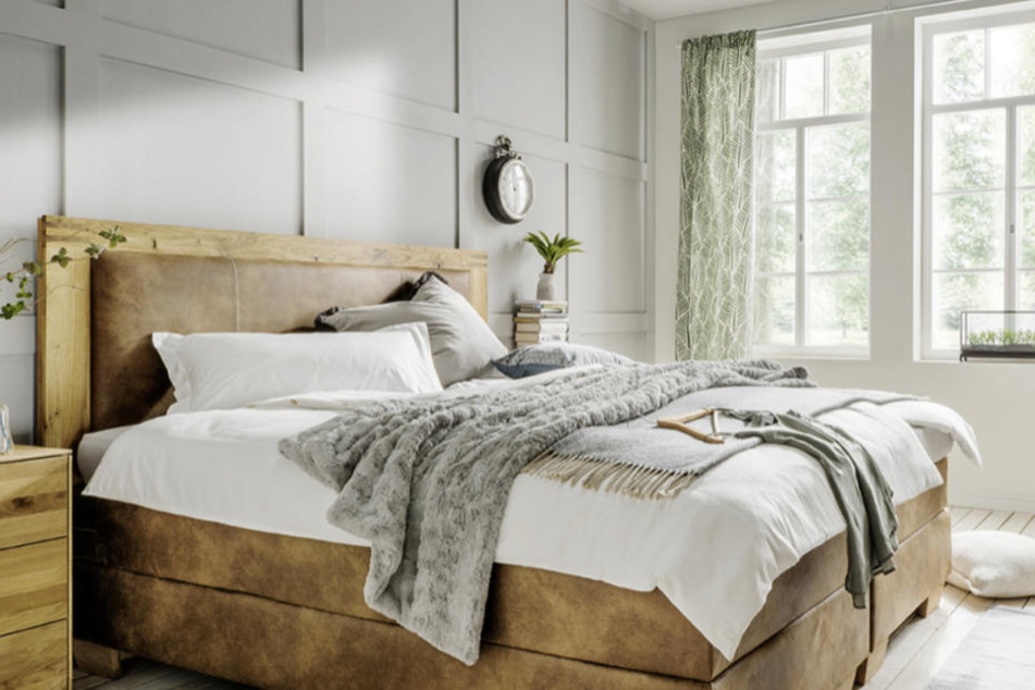 Eine schöne Kuscheldecke im Bett sorgt immer für eine gemütliche Stimmung.