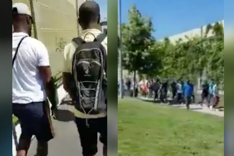 Das Video zeigt, wie mehrere Personen aus einem Zug aussteigen.