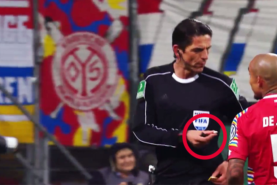 Der Screenshot aus dem Video des DFB-Pokals zeigt, Aytekin bot die Kamelle sogar den Spielern an.
