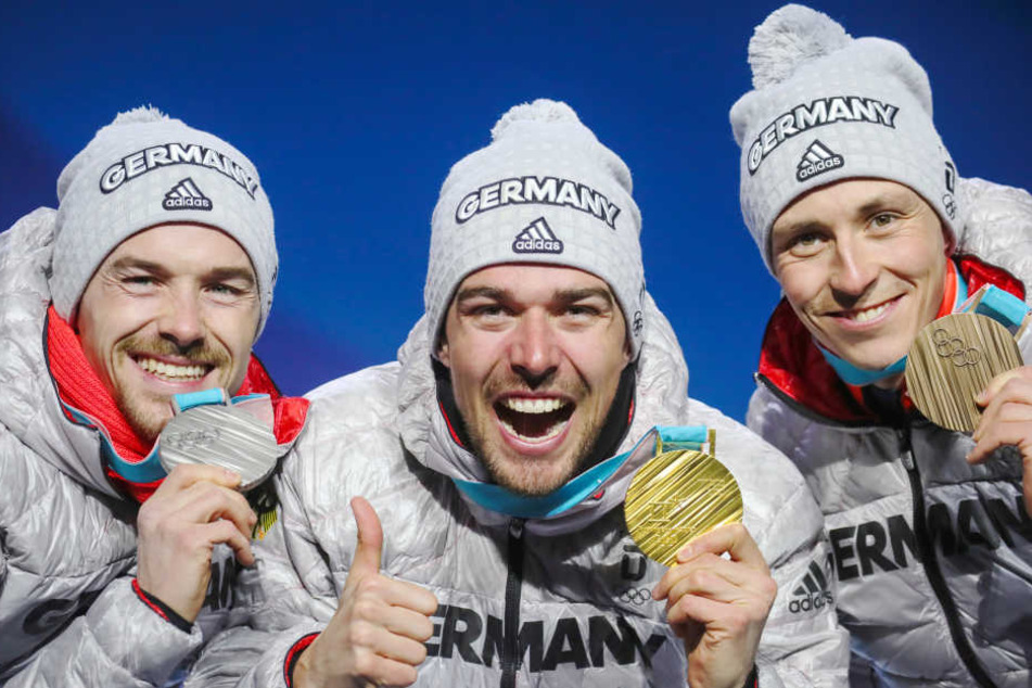 Fabian Rießle (v.l.), Johannes Rydzek und Eric Frenzel wollen heute in Pyeongchang im Staffelrennen das goldene Olympia-Triple perfektmachen.