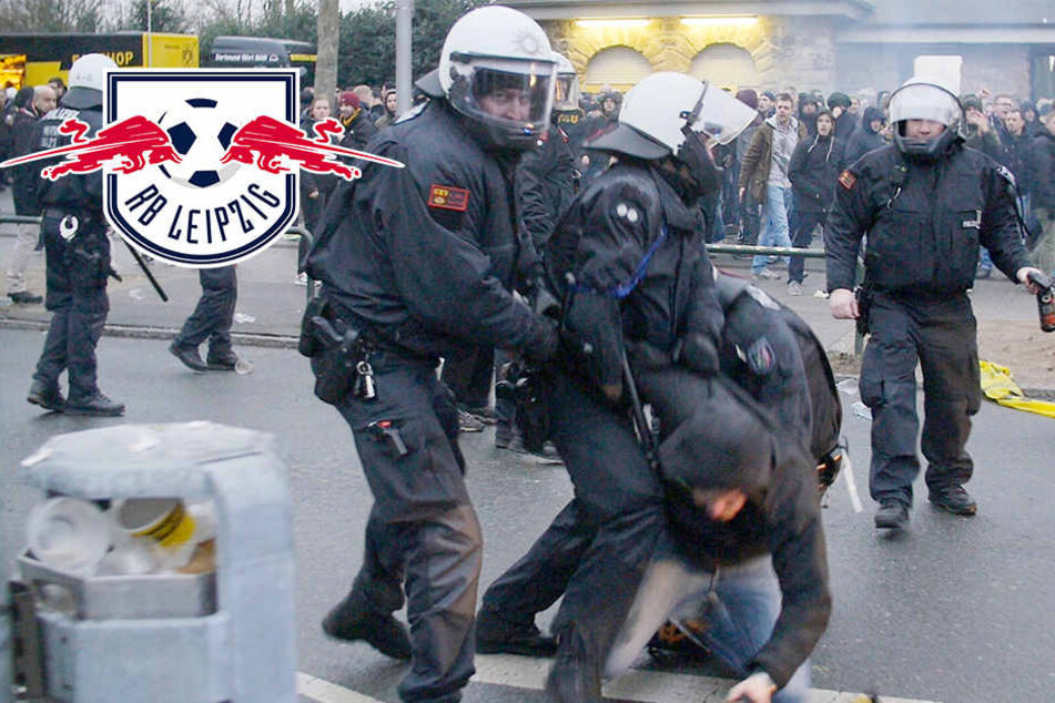 Der Screenshot aus einem Video zeigt, wie ein Dortmunder Fan von Polizisten auf dem Weg zum Stadion vorläufig festgenommen wird.