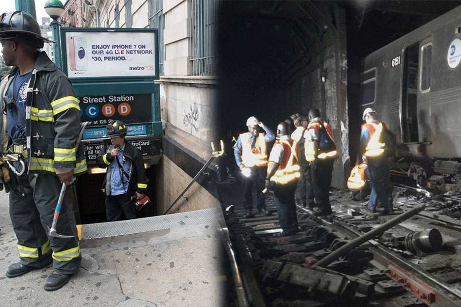Feuerwehrmänner stehen am 27.06.2017 in New York (USA) vor einer U-Bahn Station bzw. im Tunnel. Eine U-Bahn ist in der Nähe des Stadtteils Harlem entgleist.