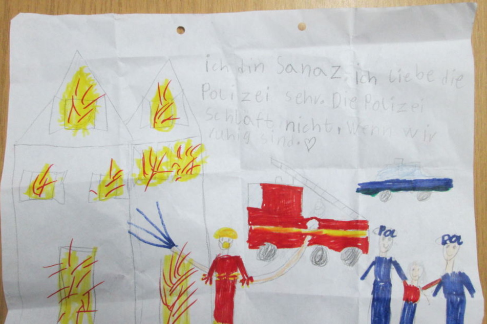 Dieses selbstgemalte Bild schenkte die Siebenjährige den Polizisten.