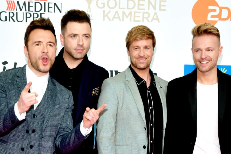 Die ersten Promigäste sind auf dem pinkfarbenen Teppich der Goldenen Kamera eingetroffen: Darunter auch die Band Westlife.