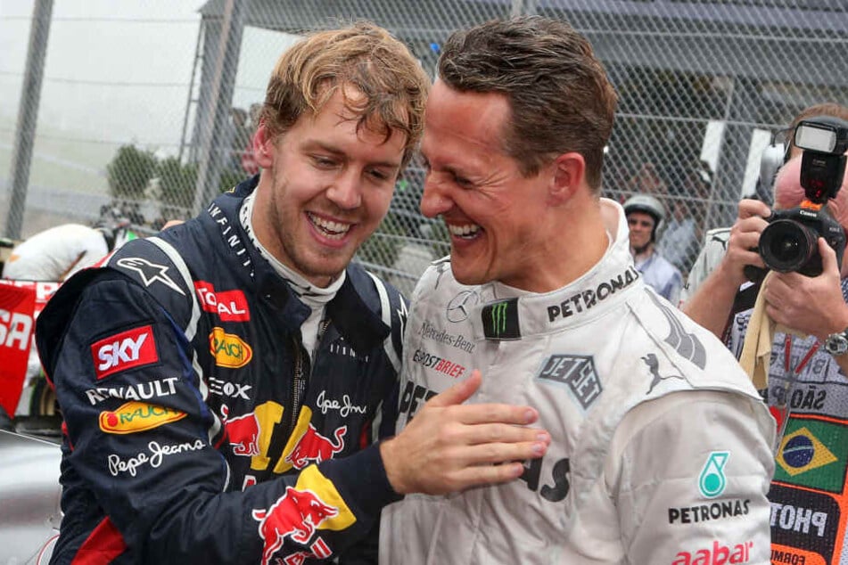 Sebastian Vettel im Jahr 2012 mit Michael Schumacher.