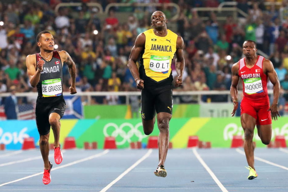 Zweiter André De Grasse aus Kanada und Usain Bolt im Zweikampf über die 200 Meter.