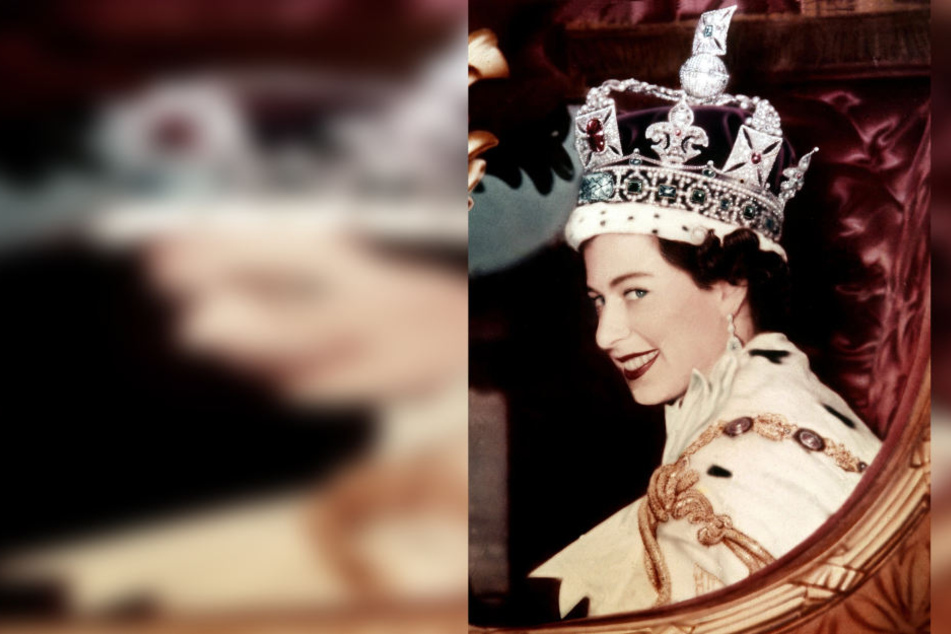Ein Blick für die Ewigkeit. Nach ihrer Krönung am 2. Juni 1953 blickt Queen
Elizabeth II. auf ihrer Kutsche aufs Volk.