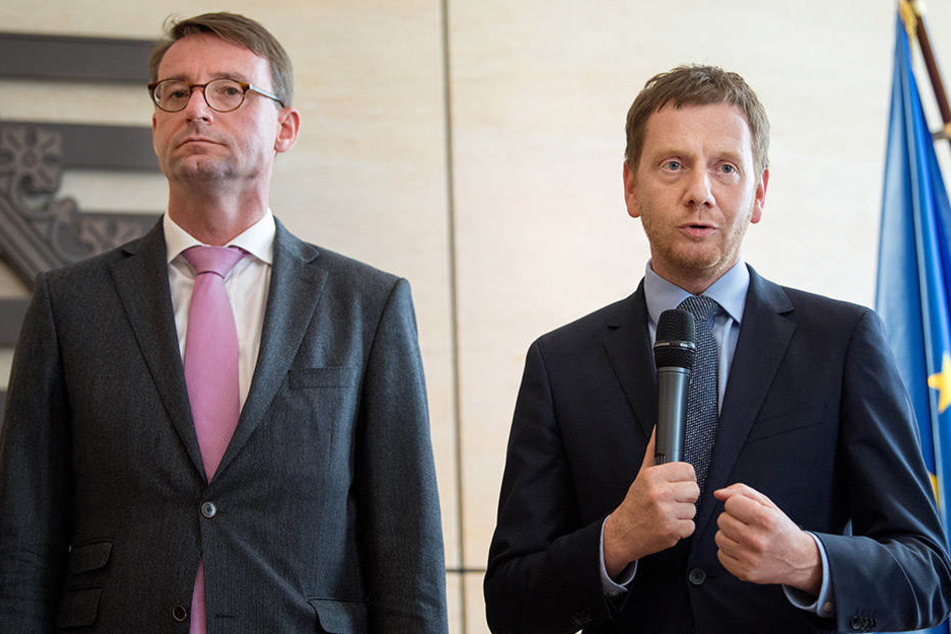 Kommunikative Verwirrung: Ministerpräsident Michael Kretschmer (42, r.) und Innenminister Roland Wöller (47, beide CDU) versuchten gestern ihre Pläne klarzustellen.