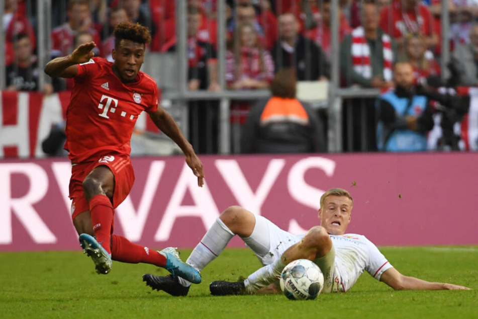Kingsley Coman (l.), hier im Zweikampf gegen Felix Kroos von Union Berlin, kommt verletzt nach München zurück. (Archiv)
