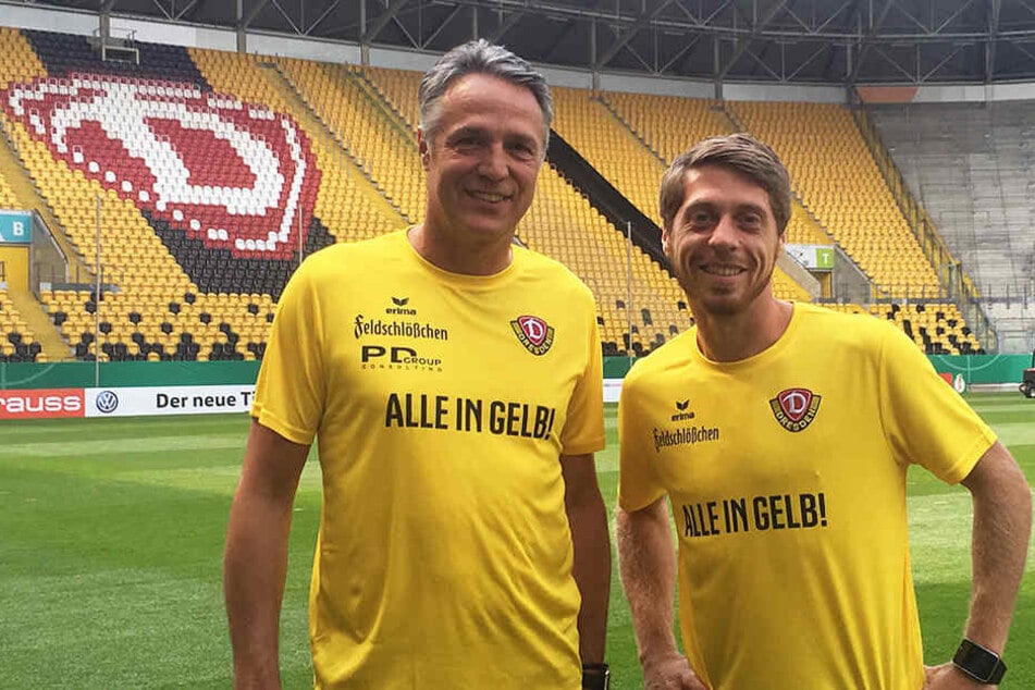Die beiden erschienen in einem Shirt mit der Aufschrift "ALLE IN GELB" - ein Aufruf der aktiven Fanszene.