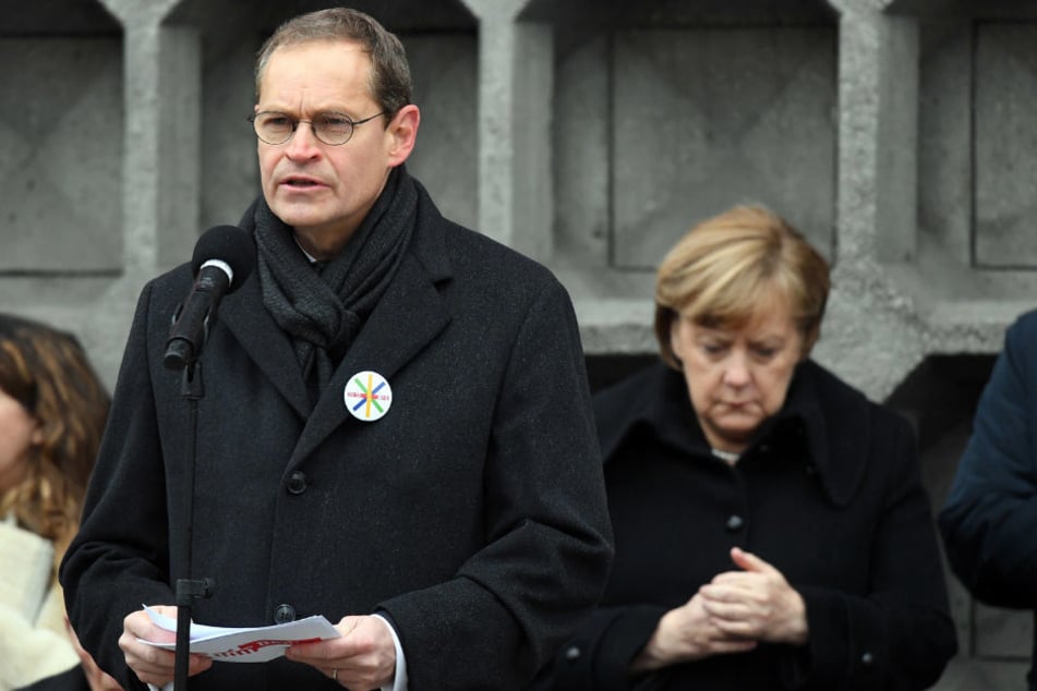 Michael Müller und Angela Merkel bei der Gedenkfeier vor einem Jahr.
