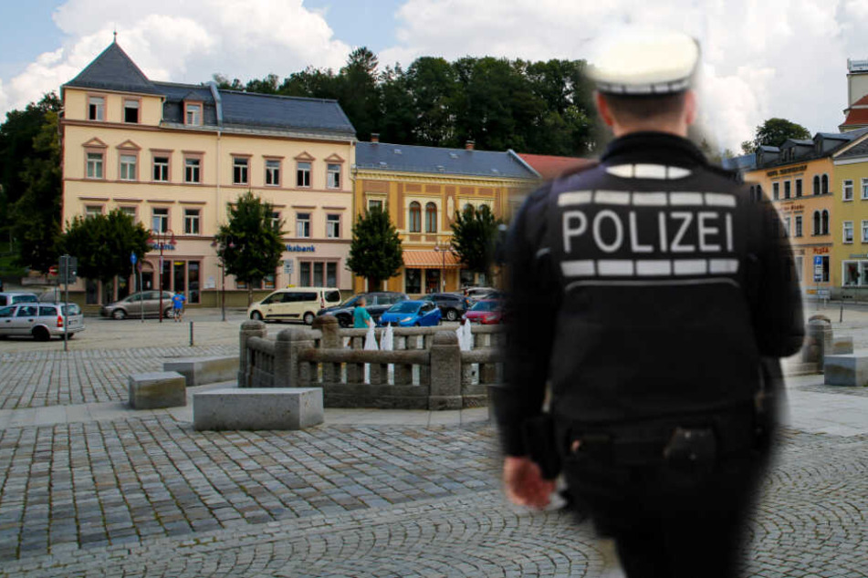 Auf dem Markt in Sebnitz geschah die Tat. Ermittelt wird wegen Bedrohung und Beleidigung. (Bildmontage)