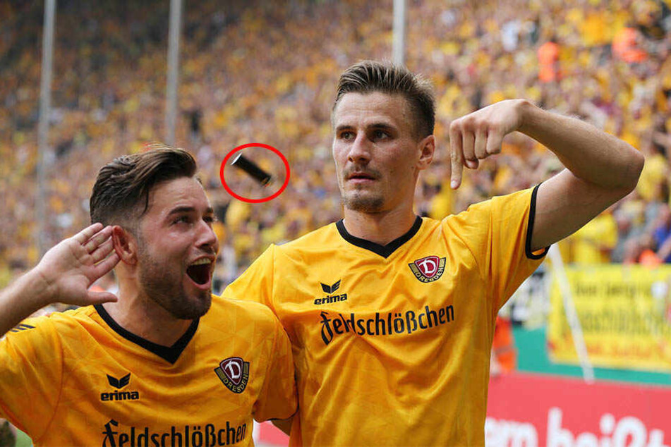 Als Niklas Kreuzer und Stefan Kutschke vor dem Leipziger Block jubeln, fliegen Gegenstände (hier ein Feuerzeug) aufs Spielfeld.