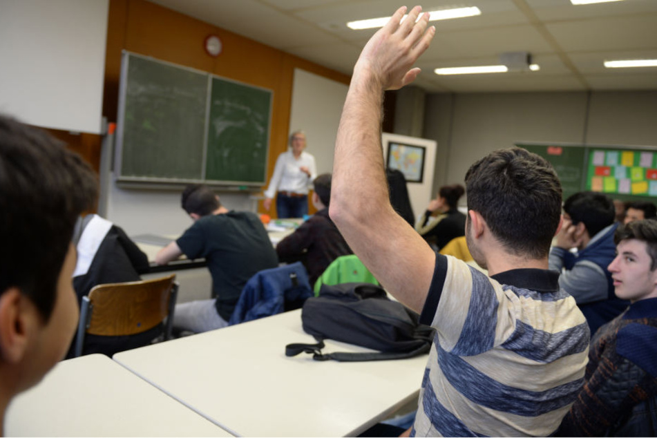 Eine gemischte Klasse, bestehend aus aus Zuwanderern, Flüchtlingen und ehemalige Flüchtlingen.
