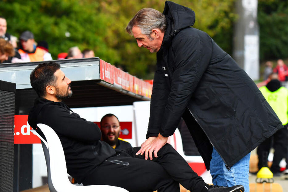 Dynamo-Sportdirektor Ralf Minge (r.) hat sein eigenes (berufliches) Schicksal an das von Trainer Cristian Fiel geknüpft.