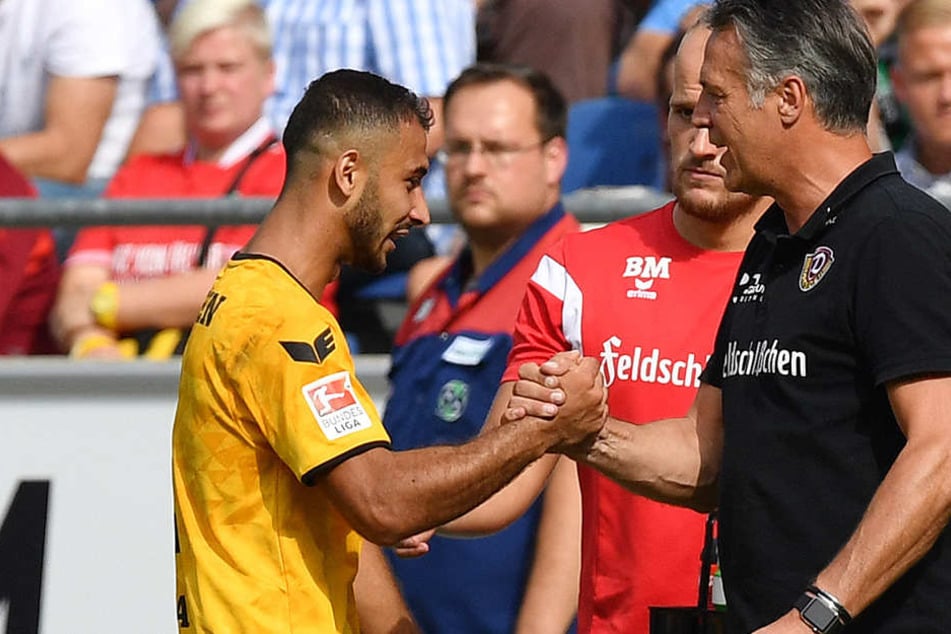 Akaki Gogia klatscht mit Dynamo-Trainer Neuhaus ab, der vor Braunschweig warnt.