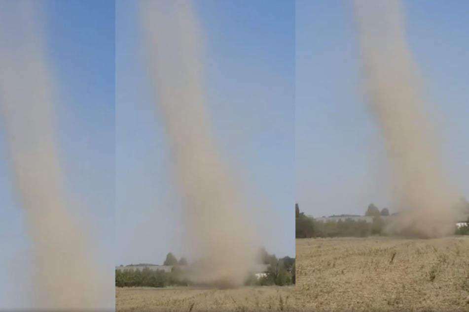 Im Video sieht man, wie eine Windhose über das staubtrockene Feld fegt.