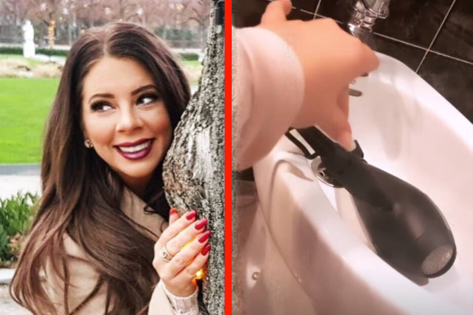 Mit spitzen Fingern will Jenny den Föhn aus dem Bidet bekommen.