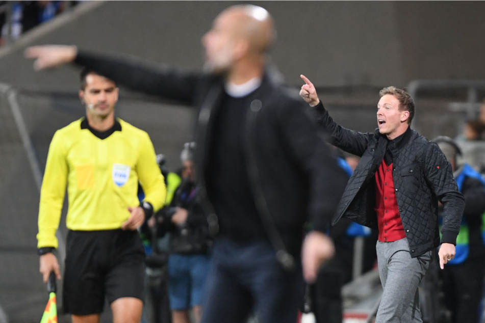 Ein Duell zwischen zwei Taktik-Füchsen: Manchester-City-Coach Pep Guardiola (l.) gegen TSG-Trainer Julian Nagelsmann. (Symbolbild)