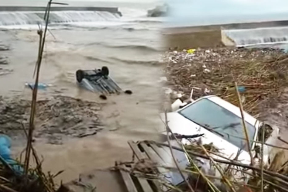 Nach dem schweren Unwetter wurden Autos von den Wassermassen mitgerissen.