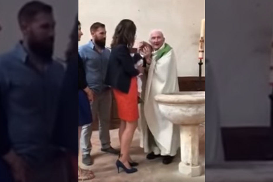Der Priester packt das Kind fest am Kopf, verpasst ihm schließlich einen Klaps. Dafür wurde der 89-Jährige nun suspendiert.