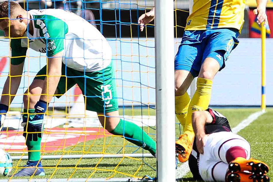 Der Ball im Tor von Keeper Marvin Schwäbe (l.), Niklas Kreuzer am Boden. Der Dresdner war beim Rettungsversuch an den Pfosten des Braunschweiger Gehäuses geprallt.