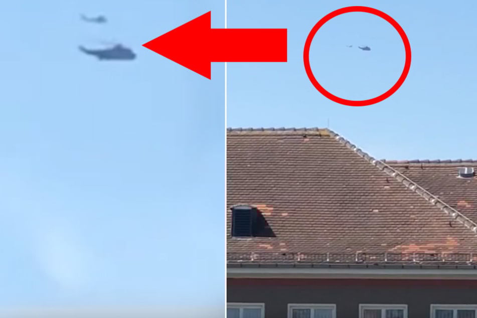 Hier fliegen ein Militär-Heli und ein Kleinflugzeug eng an eng über Dresden.