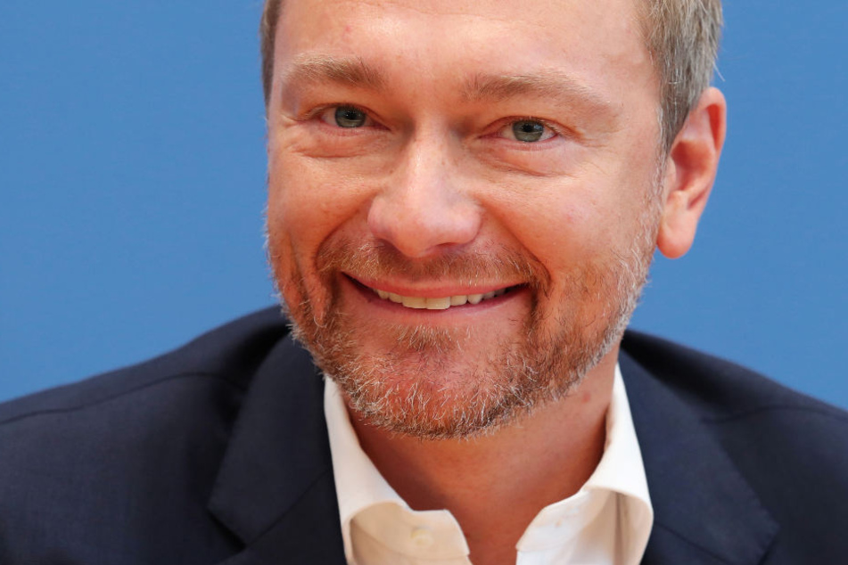 FDP-Chef Christian Lindner lächelt im Oktober dieses Jahres bei einer Pressekonferenz in die Kamera.