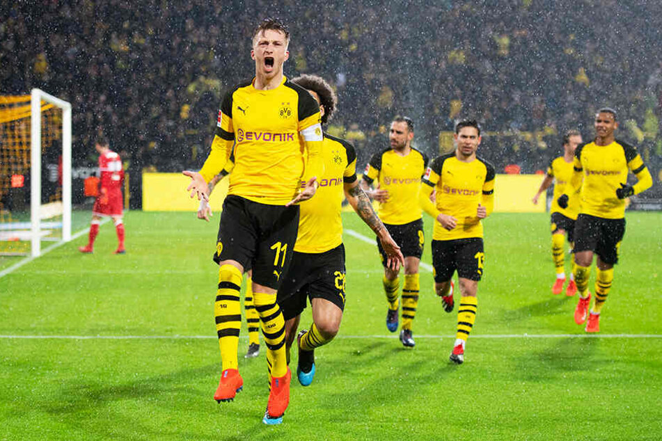Brustlöser: BVB-Kapitän Marco Reus (l.) bejubelt seinen 1:0-Führungstreffer.