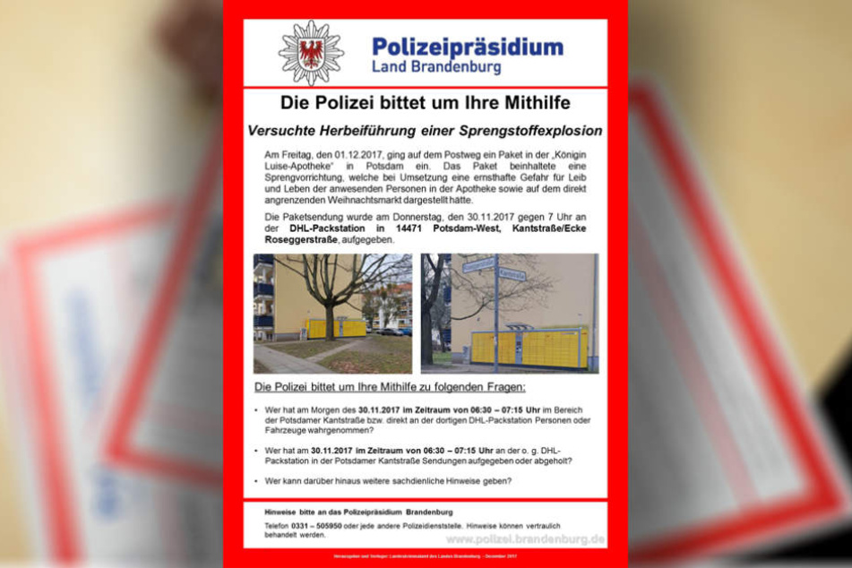 Ein Mitarbeiter der Polizei Brandenburg legt Fahndungsplakate nach einer Pressekonferenz zur Potsdamer Paketbombe Fahndungsplakate aus.