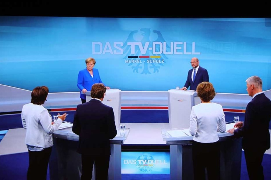 Die Fragerunde: Vier Moderatoren und die beiden Kandidaten.