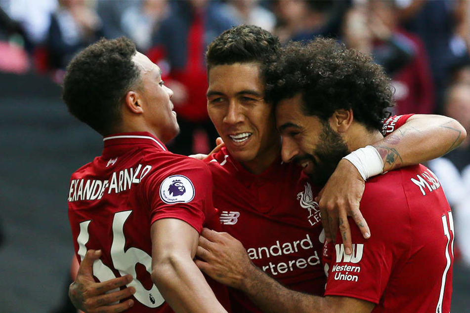 Liverpools Trent Alexander-Arnold (l.), der Ex-Hoffenheimer Roberto Firmino (M.) und Mohamed Salah (r.) eilen von Sieg zu Sieg.
