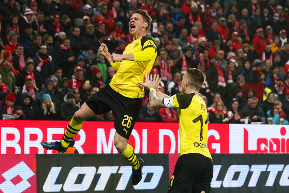 Erzielte sein erstes Tor seit dem 18. Februar 2017: Rechtsverteidiger Lukasz Piszczek (l.) schoss den BVB zum Sieg in Mainz.