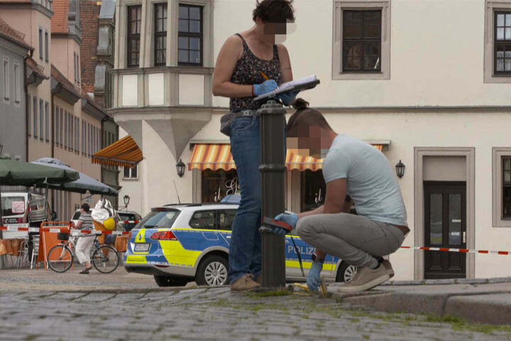 Ermittler sicherten die Spuren der möglichen Schießerei auf dem Markt.