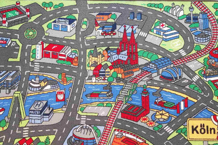 Ein genauer Blick auf den Spielteppich zeigt den Dom, das Stadion, den Kölner Zoo und viele andere Kölner stadtbekannte Bauten.