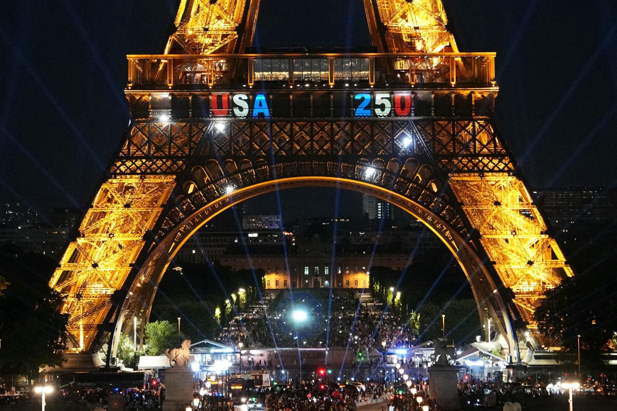 Man climbs the Eiffel tower to hang a US flag on country's 250th birthday
