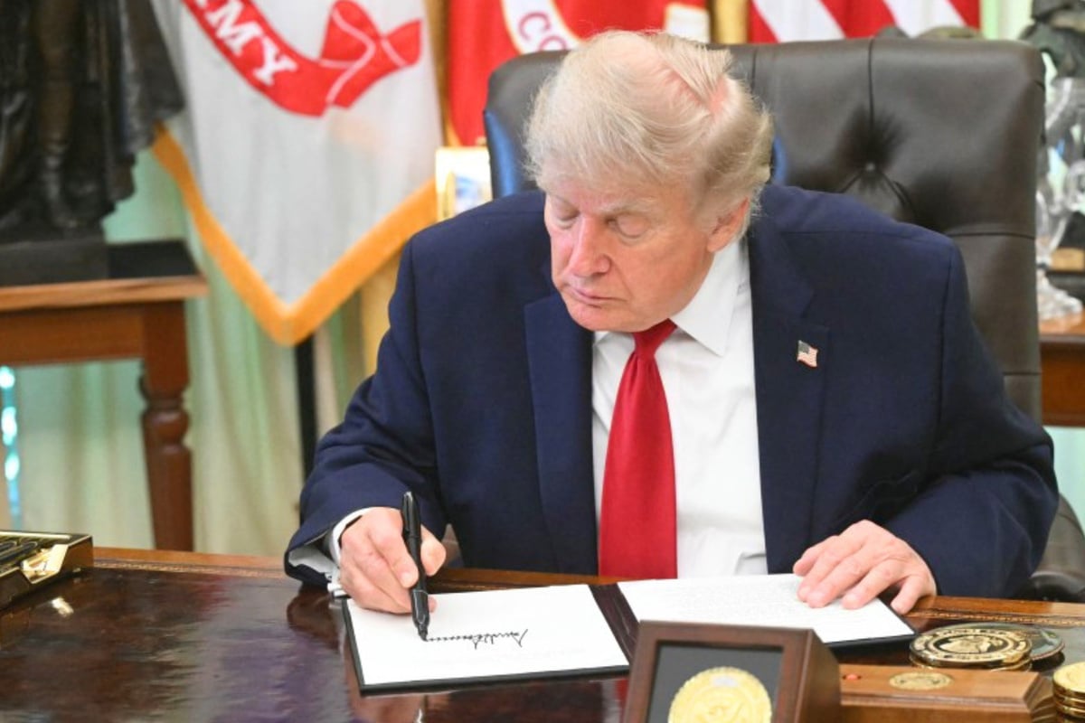 Trump signs order to remove restrictions on consumers fixing their car emission systems