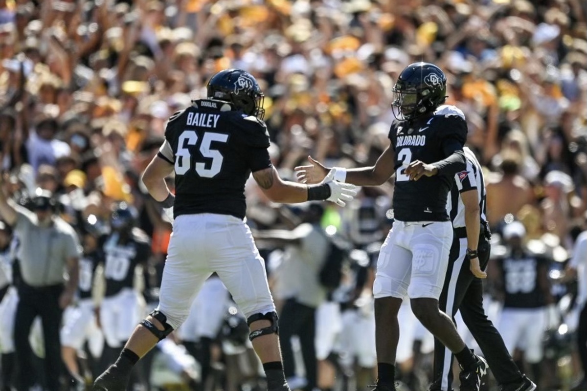 Colorado fans storm field after Deion Sanders' win over Nebraska; Shedeur  breaks out dad's touchdown dance