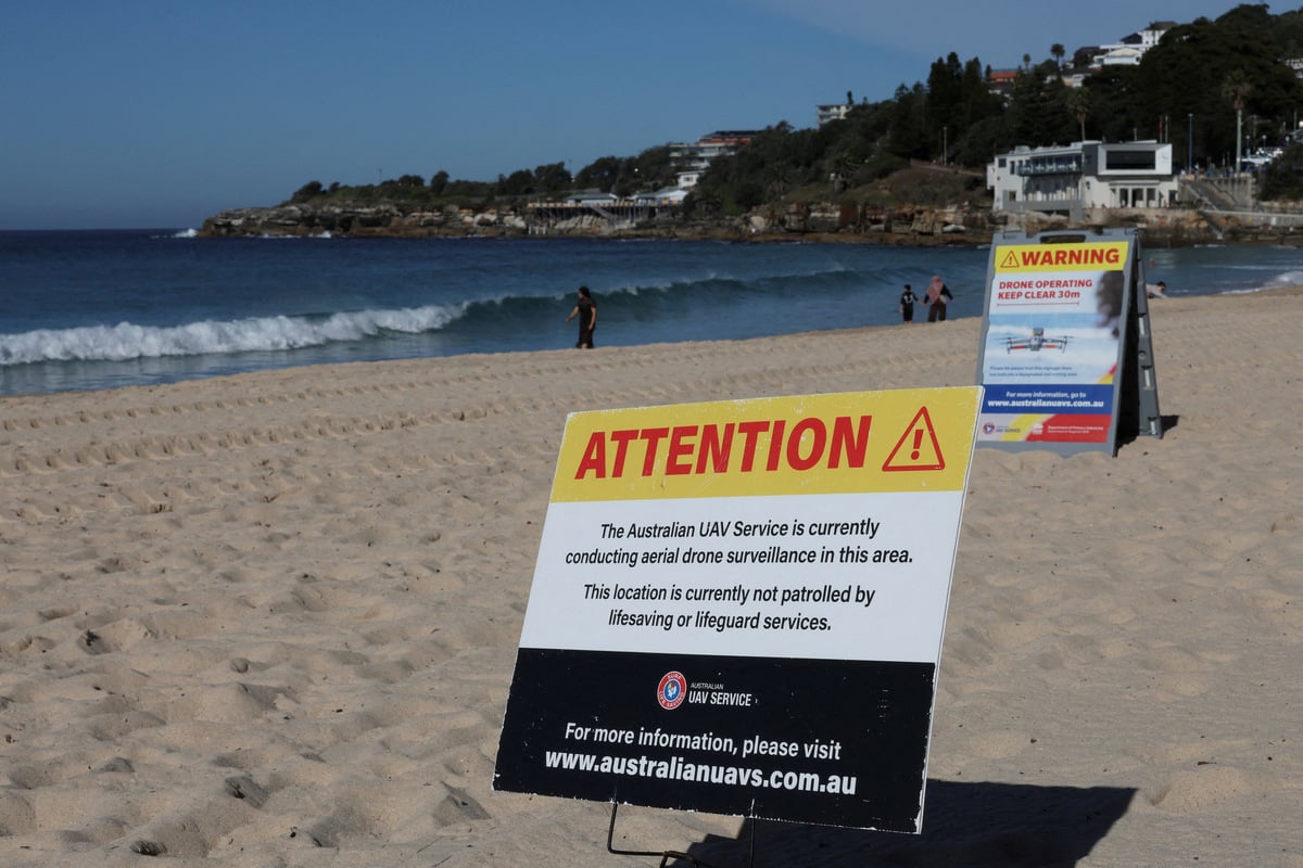 Australian woman mauled in shark attack briefly emerges from coma