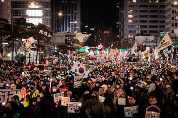 Thousands of South Koreans protest as president digs heels in against arrest