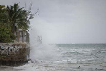 Hurricane Erin downgraded to Category 3 as it lashes the Caribbean with rain