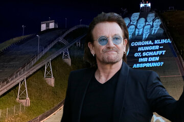 Skisprung-Schanze wird Protest-Banner: Organisation von U2-Sänger Bono bei G7-Gipfel aktiv