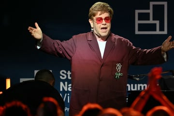 Elton John calls out "devastating effects" of Trump administration's cuts to AIDS program