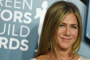 Jennifer Aniston cuddles up to boyfriend Jim Curtis in sweet Easter snap