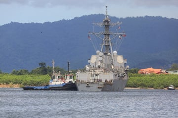US warship docks near coast of Venezuela as ominous military build-up continues