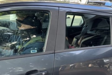 Armed agents caught on video driving off with toddler after violent LA immigration raid