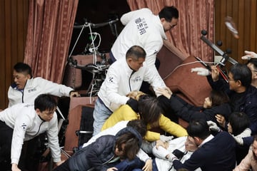 Taiwan lawmakers physically brawl over critical democracy legislation